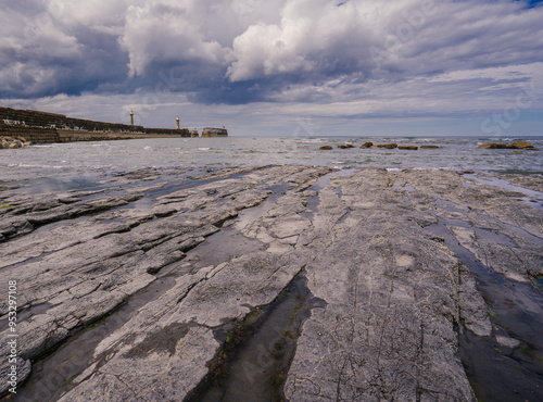 Whitby East Pier and beach at low tide