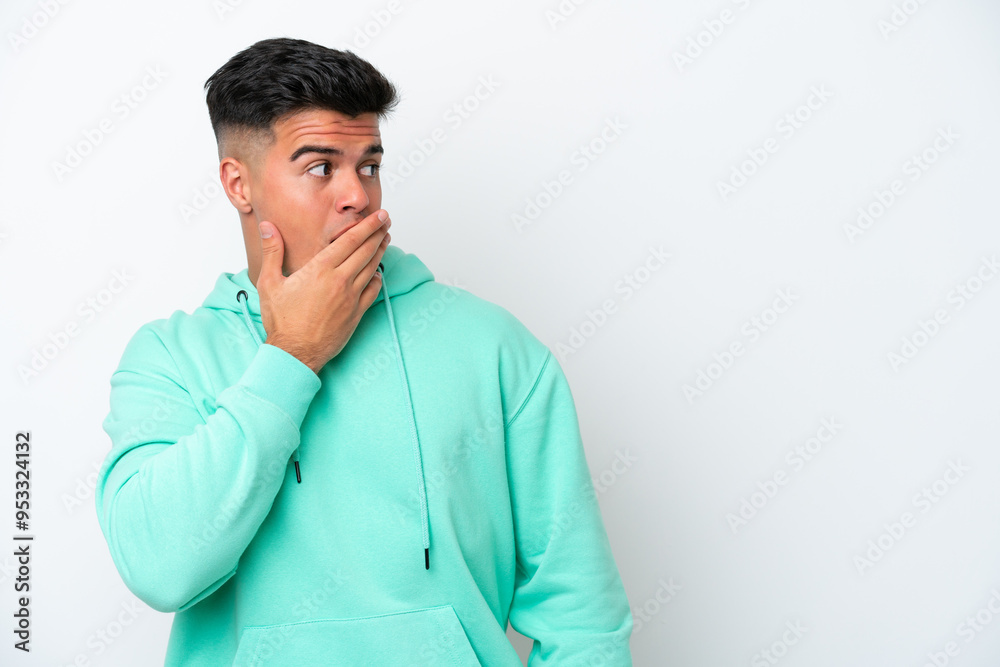 Young caucasian handsome man isolated on white background doing surprise gesture while looking to the side Young caucasian handsome man isolated on white background doing surprise gesture while looking to the side