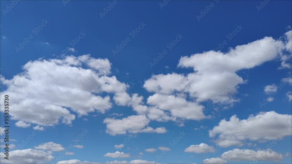 Shot of blue sky with slightly flattened cumulus clouds Shot of blue sky with slightly flattened cumulus clouds