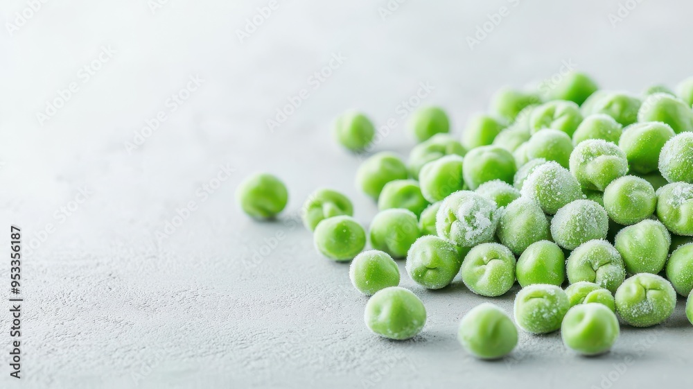 Frozen peas scattered on a table, Frozen vegetables, Quick and easy meal additions Frozen peas scattered on a table, Frozen vegetables, Quick and easy meal additions