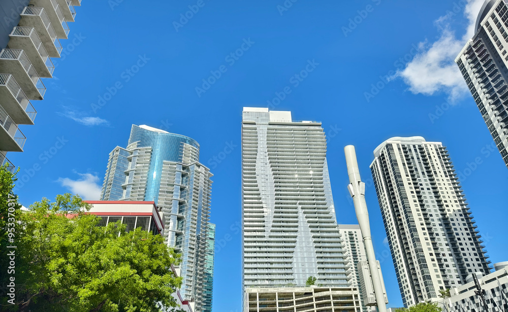 Obraz premium Miami, Florida, USA - June 26, 2024: Looking at up highrise condo towers at Park West District.