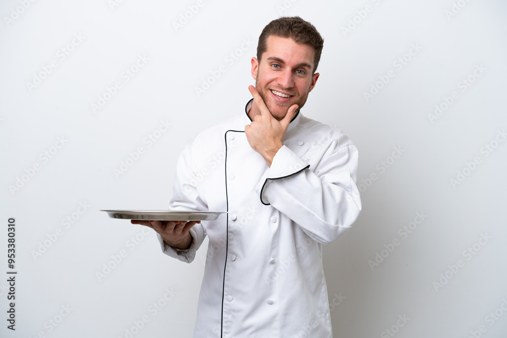 Young caucasian chef with tray isolated on white background happy and smiling Young caucasian chef with tray isolated on white background happy and smiling