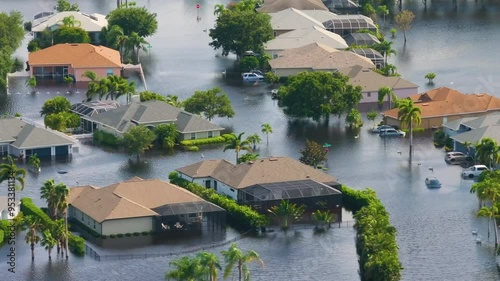 Flooding in Florida caused by tropical storm from hurricane Debby. Suburb houses in Laurel Meadows residential community surrounded by flood waters in Sarasota. Aftermath of natural disaster