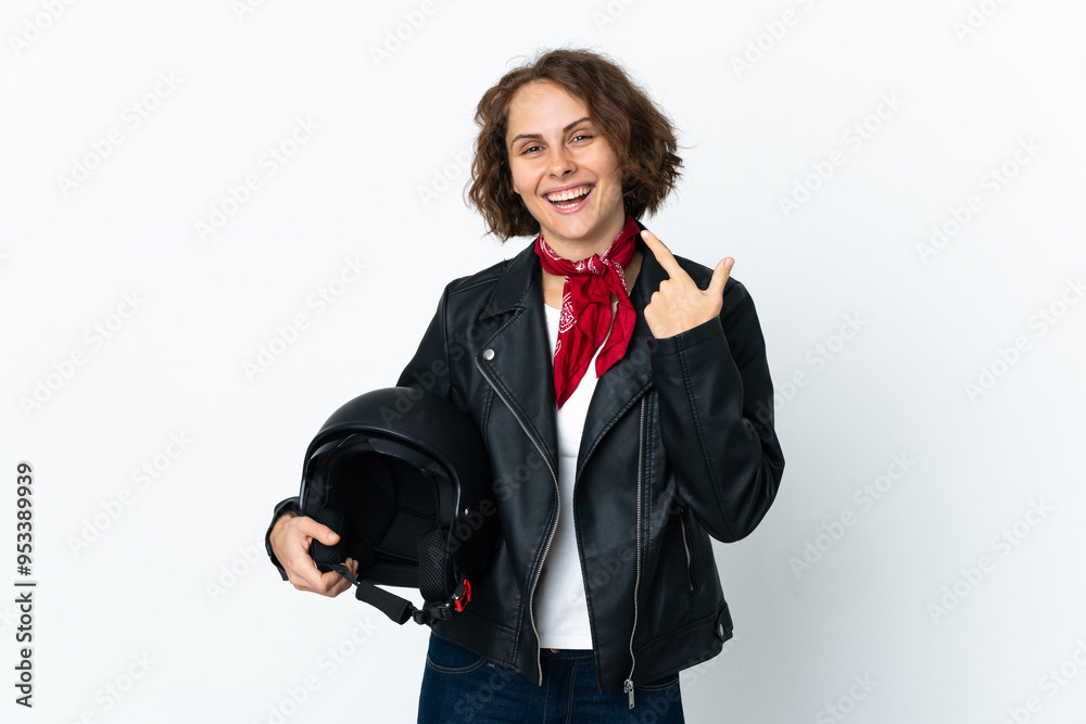 English woman holding a motorcycle helmet isolated on white background giving a thumbs up gesture English woman holding a motorcycle helmet isolated on white background giving a thumbs up gesture