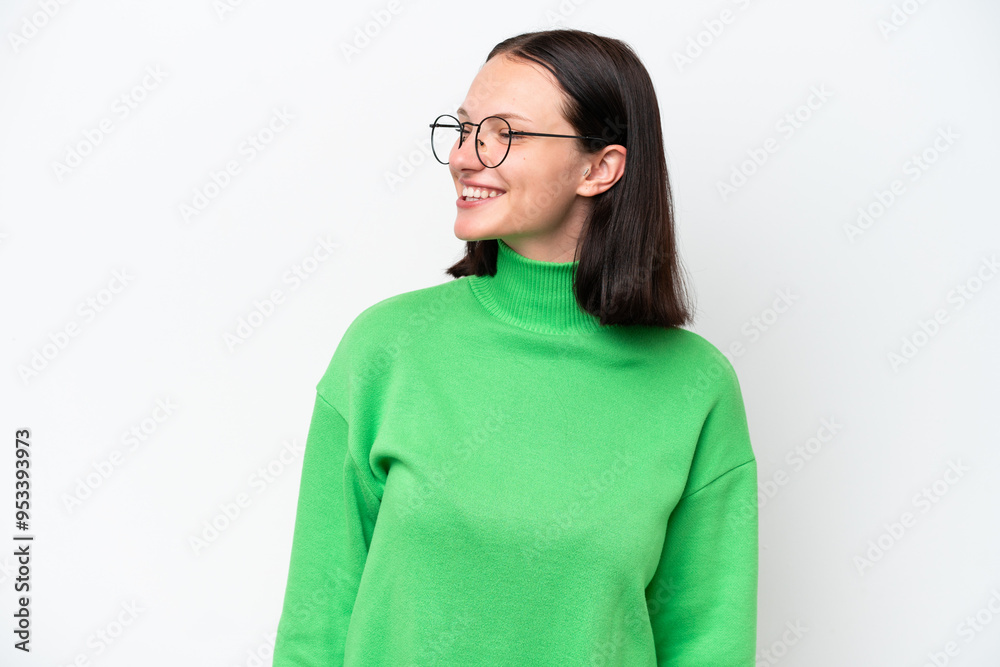 Young caucasian woman isolated on white background looking to the side and smiling Young caucasian woman isolated on white background looking to the side and smiling