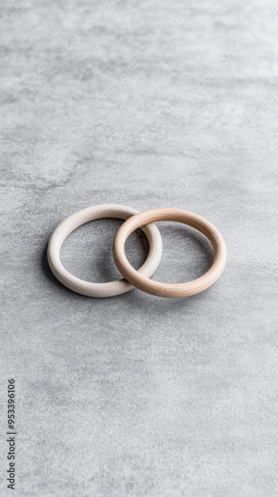 Minimalist interlocked wooden rings in earthy tones Minimalist interlocked wooden rings in earthy tones