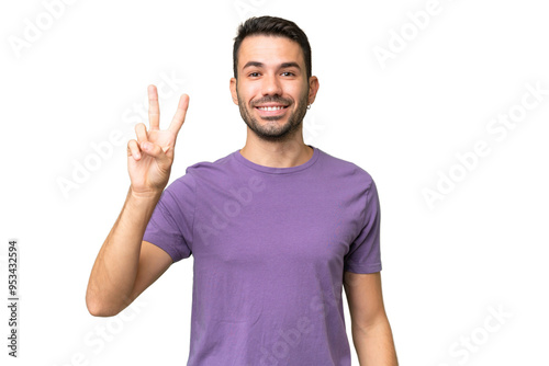 Young handsome caucasian man over isolated background smiling and showing victory sign