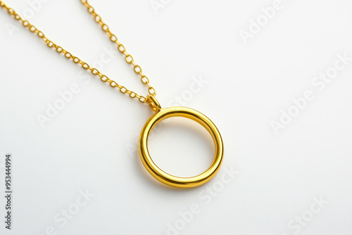 Minimalist gold necklace with a simple open circle pendant on a white background