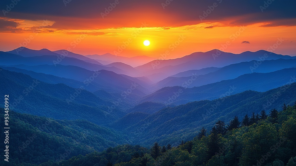 The sun is setting over mountainous valley with forest in foreground and tree lines in focus The sun is setting over mountainous valley with forest in foreground and tree lines in focus