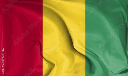 An up close view of Guinea flag flying textures photo