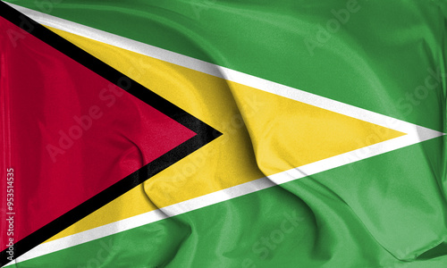 An up close view of Guyana flag flying textures