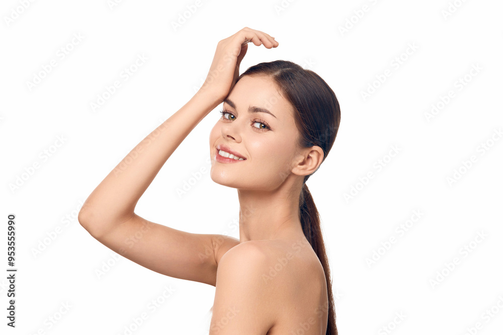Beautiful young woman with long hair posing for the camera on a white background Beautiful young woman with long hair posing for the camera on a white background
