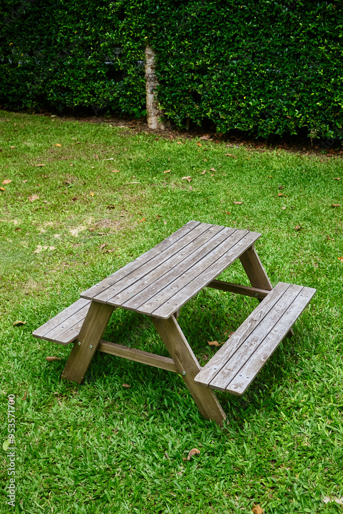 Old wooden table in green garden Old wooden table in green garden