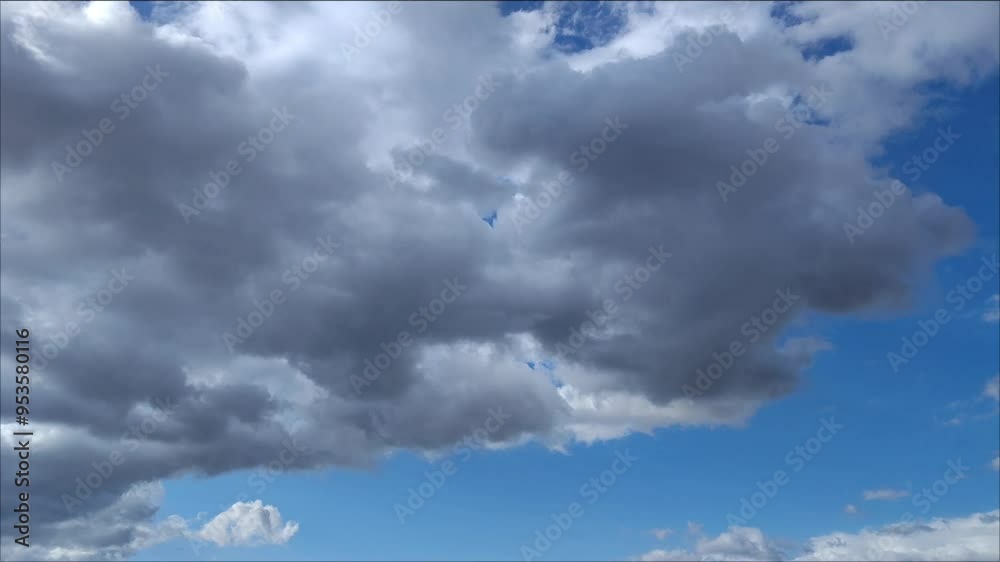 Strange dark mixture of Cumulus and Altocumulus moving across bright sky Strange dark mixture of Cumulus and Altocumulus moving across bright sky