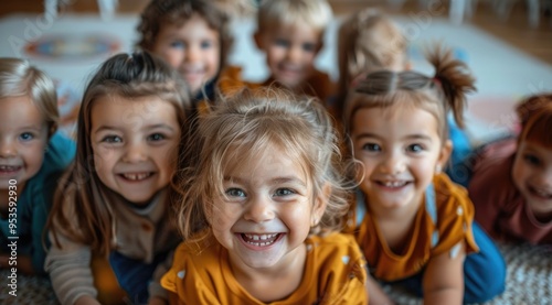Happy preschool children lying on mat