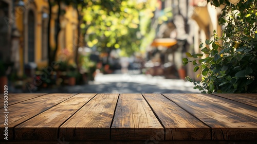 A rustic wooden table set against a blurred urban street, perfect for outdoor dining themes or product presentations. photo