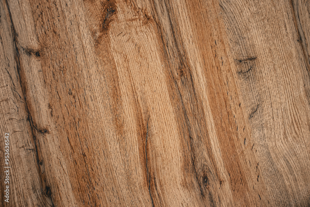 Naklejka premium Textured wooden surface with natural grain details. Ideal for home decor or rustic design projects featuring organic materials