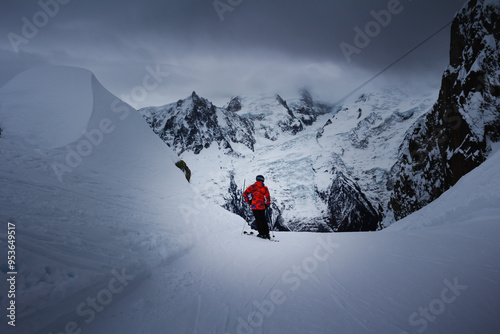 Panorama of the ski resort in alps. drama sky, mountain peaks, ski lift, skiers. high resolution photo.