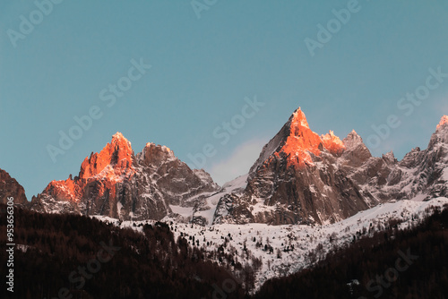 Panorama of the ski resort in alps. drama sky, mountain peaks, ski lift, skiers. high resolution photo.
