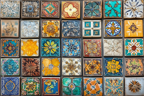 Wallpaper Mural Brightly colored tiles with traditional patterns. Arranged neatly on the wall, each tile is painted with a unique design. Torontodigital.ca