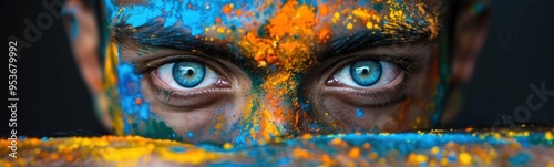 Someone has painted their eyes and face blue and yellow, holi holiday , banner