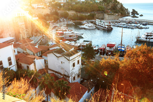 Antalya Marina: Ancient Roman Harbor with Lens Flare at Sunrise – Scenic Yacht and Boat Dock photo