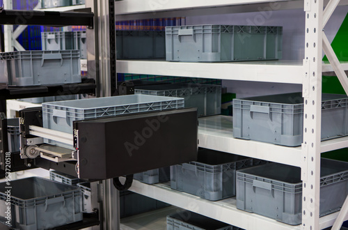 Vertical storage ergonomic solution. Automated storage and retrieval system. Modern industrial warehouse.	