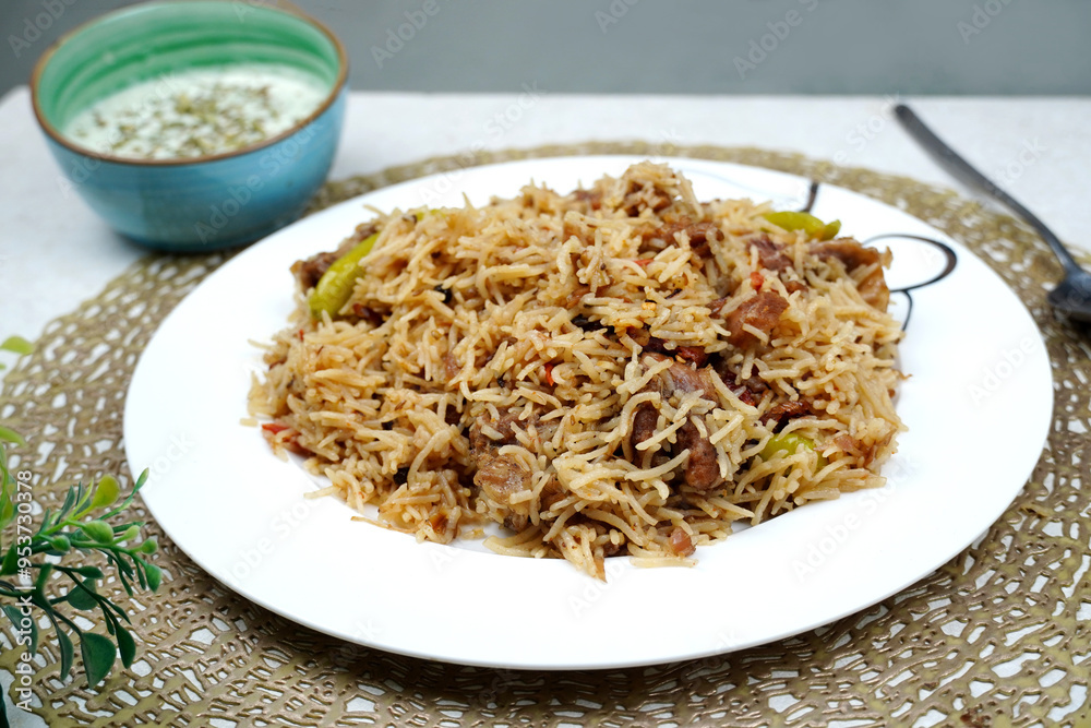 Beef pulao in white plate. Beef Yakhni Pulao. plate of rice
