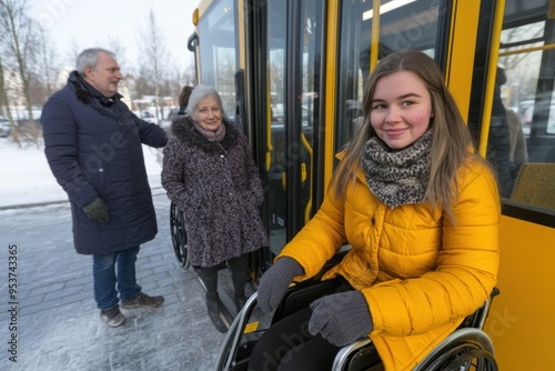 A woman in a wheelchair is sitting on a yellow bus