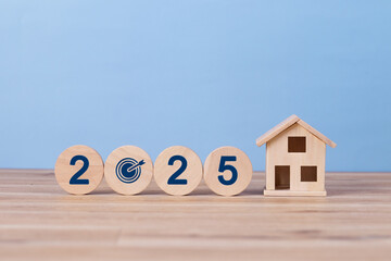 2025 New year property investment concept. Wooden blocks spell "2025" with a target icon. Property tax, New home, rent, real estate, asset management, Business and financial. land. building loans.