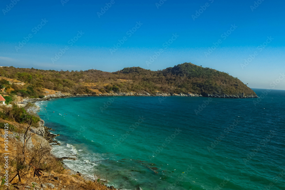 Aerial panorama of Thailand's verdant, with blue and aquamarine the sea, and clouds shining by sunlight in the background. Aerial panorama of Thailand's verdant, with blue and aquamarine the sea, and clouds shining by sunlight in the background.
