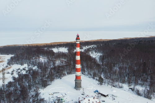 Snowy aerial drone view of Storozhenskiy Light, Ladoga Lake, Storozhno Lighthouse, Storozhno village, Leningrad oblast region, Russia, winter sunny day, lighthouses of Russia travel photo