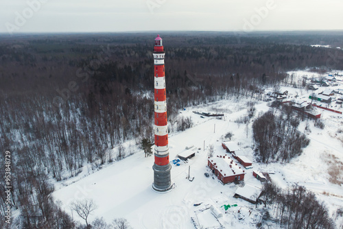 Snowy aerial drone view of Storozhenskiy Light, Ladoga Lake, Storozhno Lighthouse, Storozhno village, Leningrad oblast region, Russia, winter sunny day, lighthouses of Russia travel photo