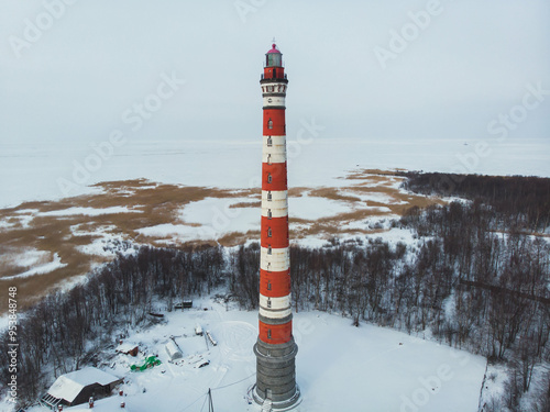 Snowy aerial drone view of Storozhenskiy Light, Ladoga Lake, Storozhno Lighthouse, Storozhno village, Leningrad oblast region, Russia, winter sunny day, lighthouses of Russia travel photo