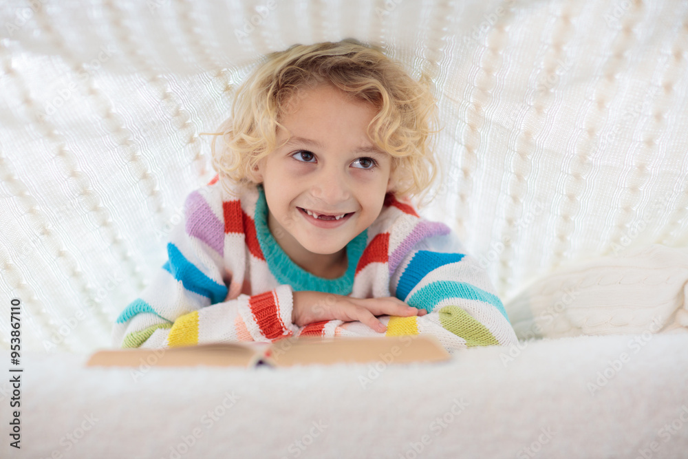 Child reading book in bed. Kids read books. Child reading book in bed. Kids read books.