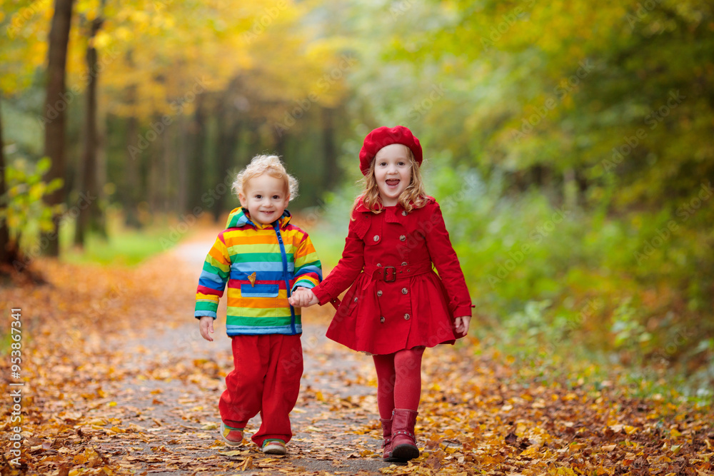 Kids playing in autumn park Kids playing in autumn park
