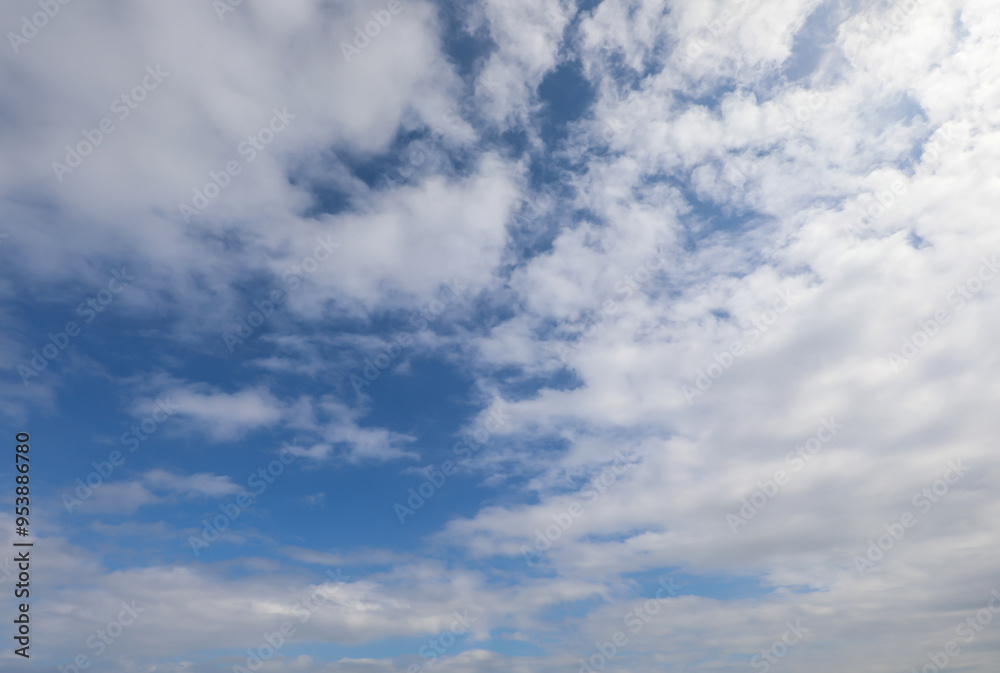 background of intense blue sky with white clouds above ideal as a nature backdrop background of intense blue sky with white clouds above ideal as a nature backdrop