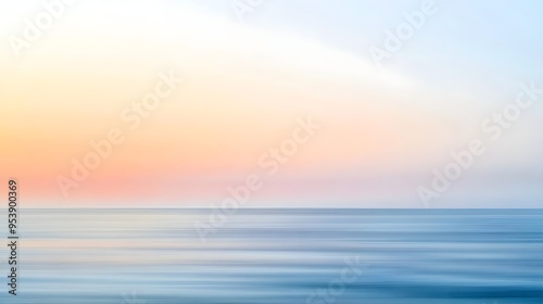 A blurred seascape at sunrise with soft pastel colors blending into the horizon, conveying a sense of tranquility