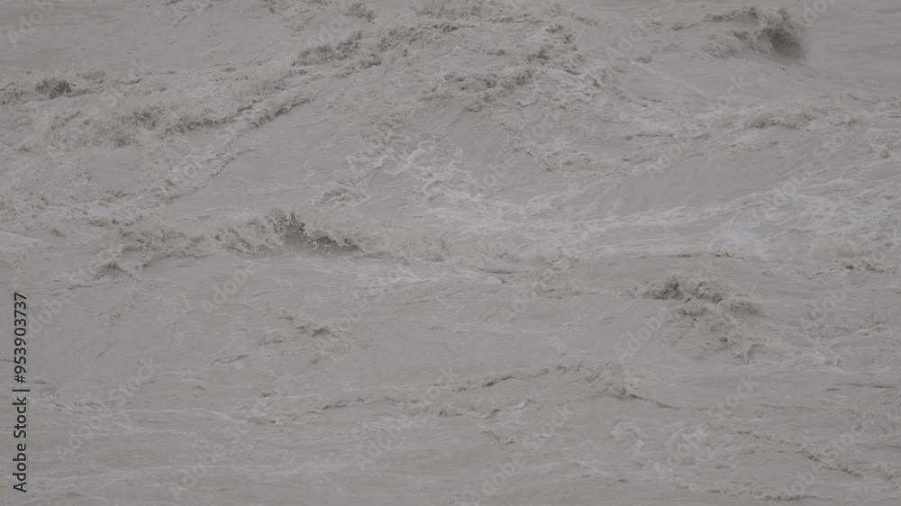 Turbulent muddy waters massive rapids in a river Turbulent muddy waters massive rapids in a river