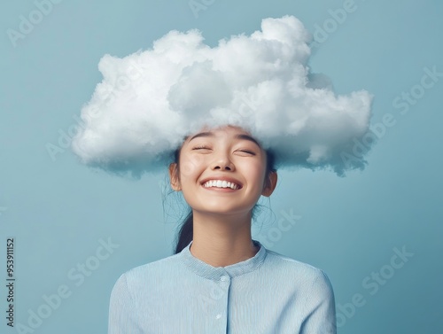 Joyful woman with a cloud on her head, representing creativity and imagination. Blue background. Perfect for artistic and whimsical concepts.