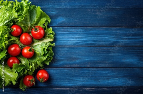 Fresh Tomatoes and Lettuce on Blue Wooden Background