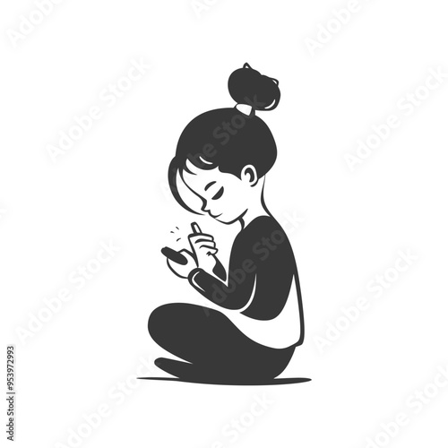 A young woman sits cross legged on the floor intently looking at her phone