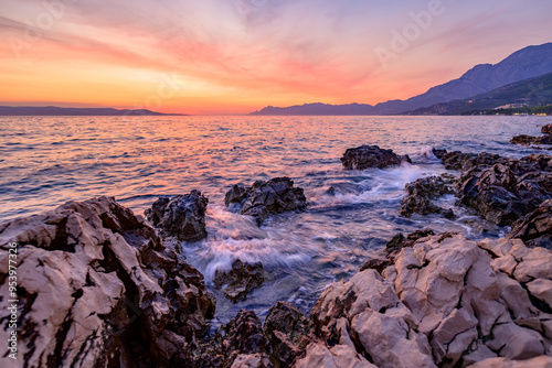 Colorful sunset on Makarska Riviera, popular touristic coastline of the Adriatic Sea in Split-Dalmatia County of Croatia