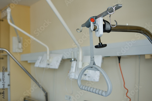 Hospital bed trapeze lift bar. Triangle in a hospital bed adapted to the sick, help and support.