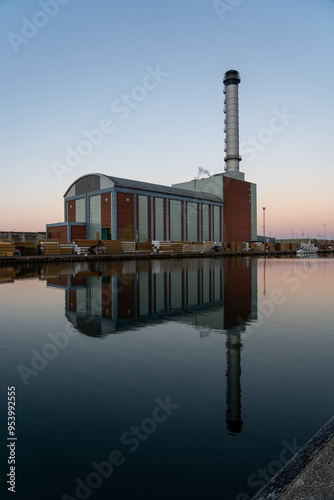 Reflections of a gas fired power station at dawn.