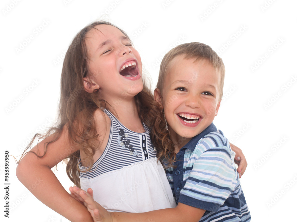 Portrait of two cheerful siblings, Little boy and girl goofing and laughing on white background Portrait of two cheerful siblings, Little boy and girl goofing and laughing on white background