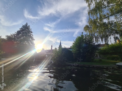 starkes Sonnenlicht und Sicht auf den Müggelsee - Fluss in Berlin Rahnsdorf photo