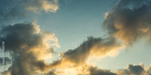 Beautiful tender sunrise sky with clouds. Sky background. 