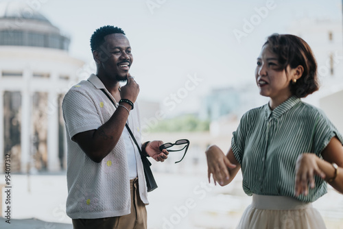 Multicultural businesspeople in an outdoor meeting at the city. Mixed race individuals engaging in a business discussion photo