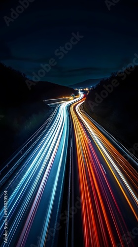 A long exposure photograph of the lights from cars on a highway at night